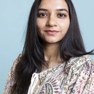 indian-woman-posing-cute-stylish-outfit-camera-smiling