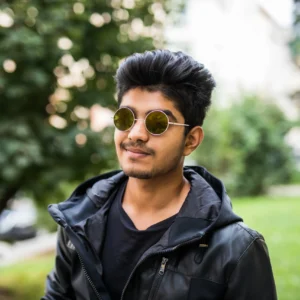 young-handsome-indian-man-wearing-sunglasses-while-thinking-against-street-outdoors
